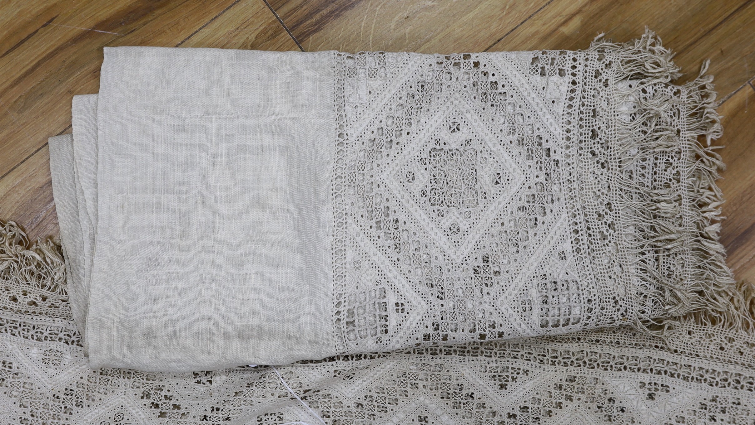 A pair of 19th century Greek hand worked and embroidered linen pelmets, 440cms long (each)